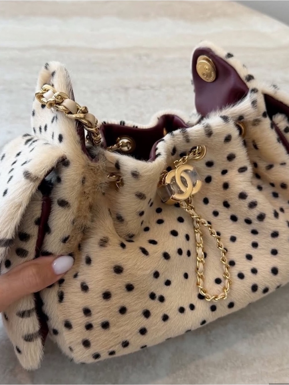 CHANEL Cream Spotted Fur Drawstring Shoulder Bag with Gold Hardware